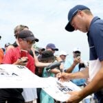 Jordan Spieth signs autographs for fans on Tuesday at the PGA Championship.