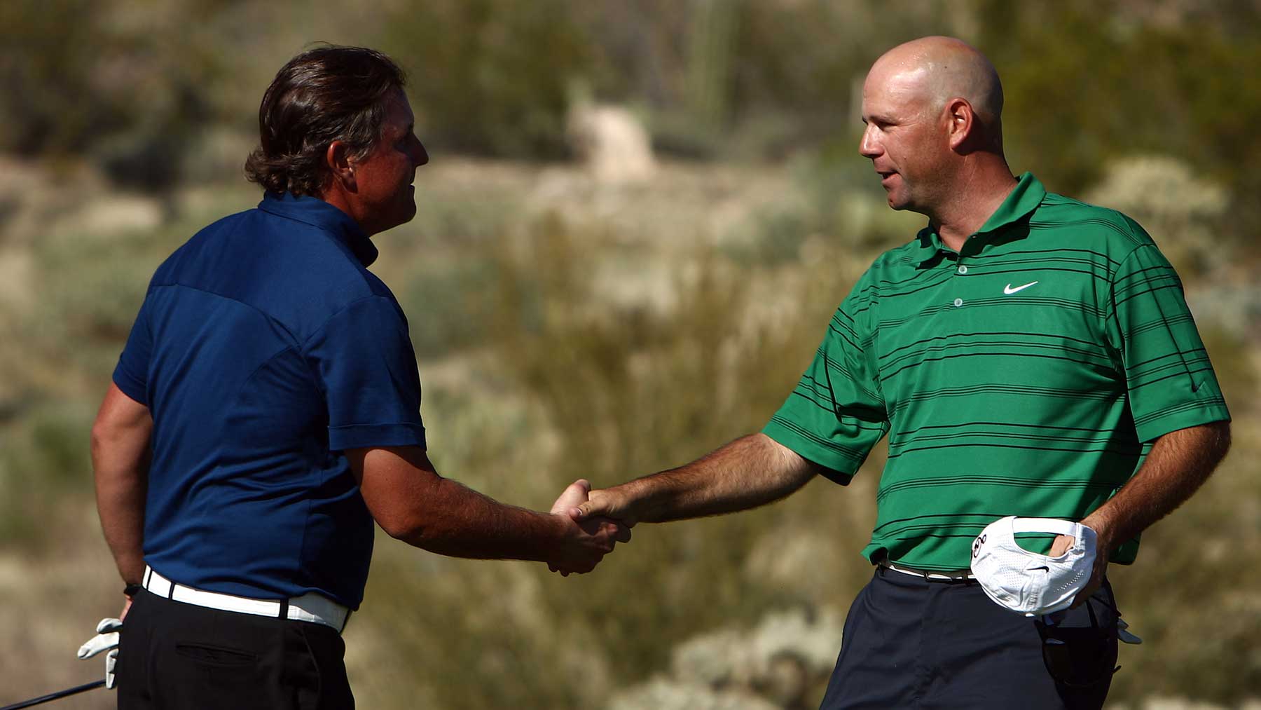Stewart Cink shakes the hand of Phil Mickelson after Cink's 1-Up victory in the 18th hole during the third round of the Accenture Match Play Championships at the Ritz-Carlton Golf Club at Dove Mountain on February 27, 2009 in Marana, Arizona. Mickelson lost to Stewart Cink 1-Up. (