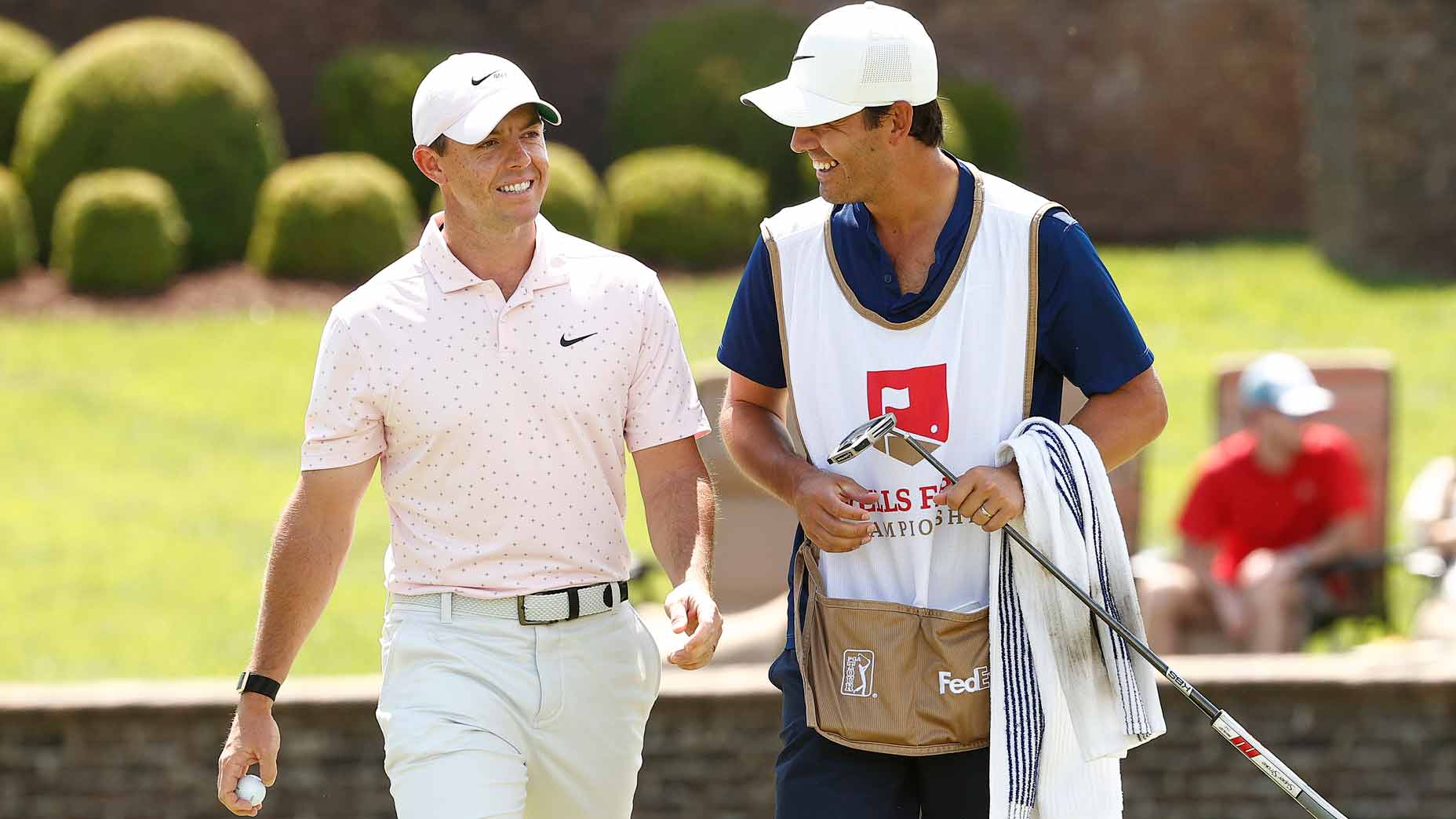 Rory McIlroy walks with a caddy during the 2021 Wells Fargo Championship
