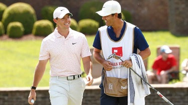 Rory McIlroy walks with caddie during 2021 Wells Fargo Championship