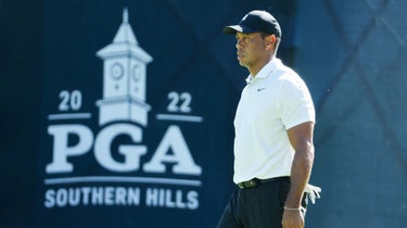 Tiger Woods stands in front of PGA Championship sign at 2022 PGA Championship