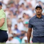 Rory McIlroy and Tiger Woods stand on tee at 2022 PGA Championship