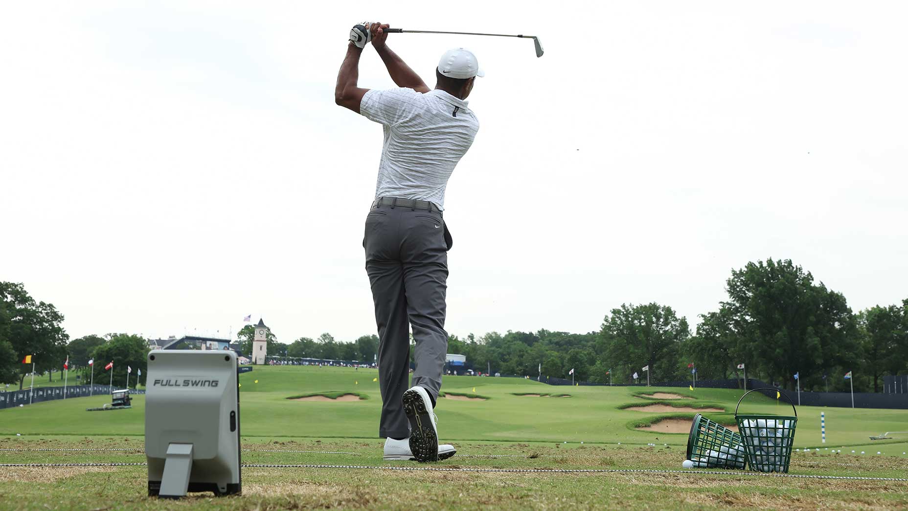 Tiger Woods hits a shot on the range on Wednesday.