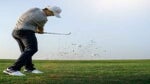 golfer swings