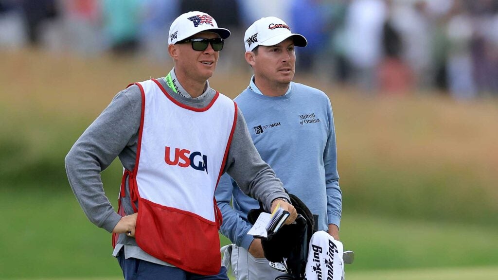 Joel Dahmen and Geno Bonnalie talk over a shot during the third round of the U.S. Open.