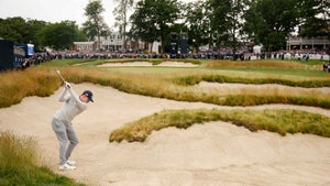 matt fitzpatrick plays shot from a fairway bunker on the 18th hole