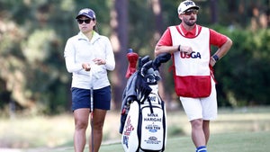 mina harigae stands with her caddie