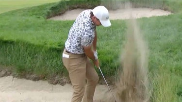Rory mcilroy swipes at the sand at the us open on thursday.