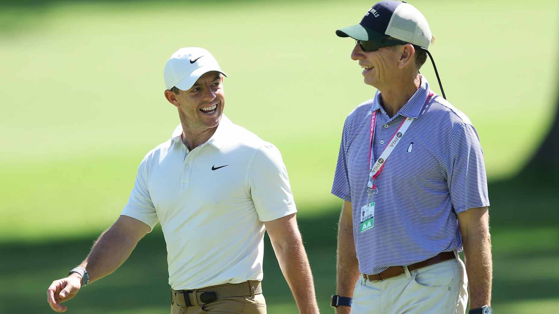 Rory McIlroy walks with coach at the 2022 US Open