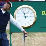 Tiger Woods stretched out during a wait on Thursday at St. Andrews' Old Course.