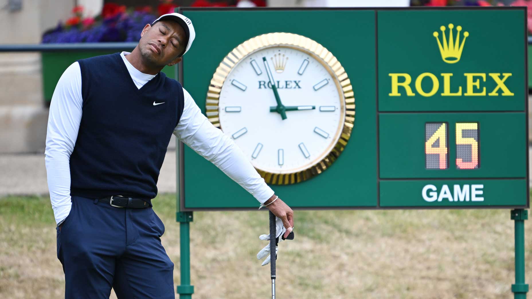 Tiger Woods lay down during a hold Thursday at the Old Course in St. Andrews.