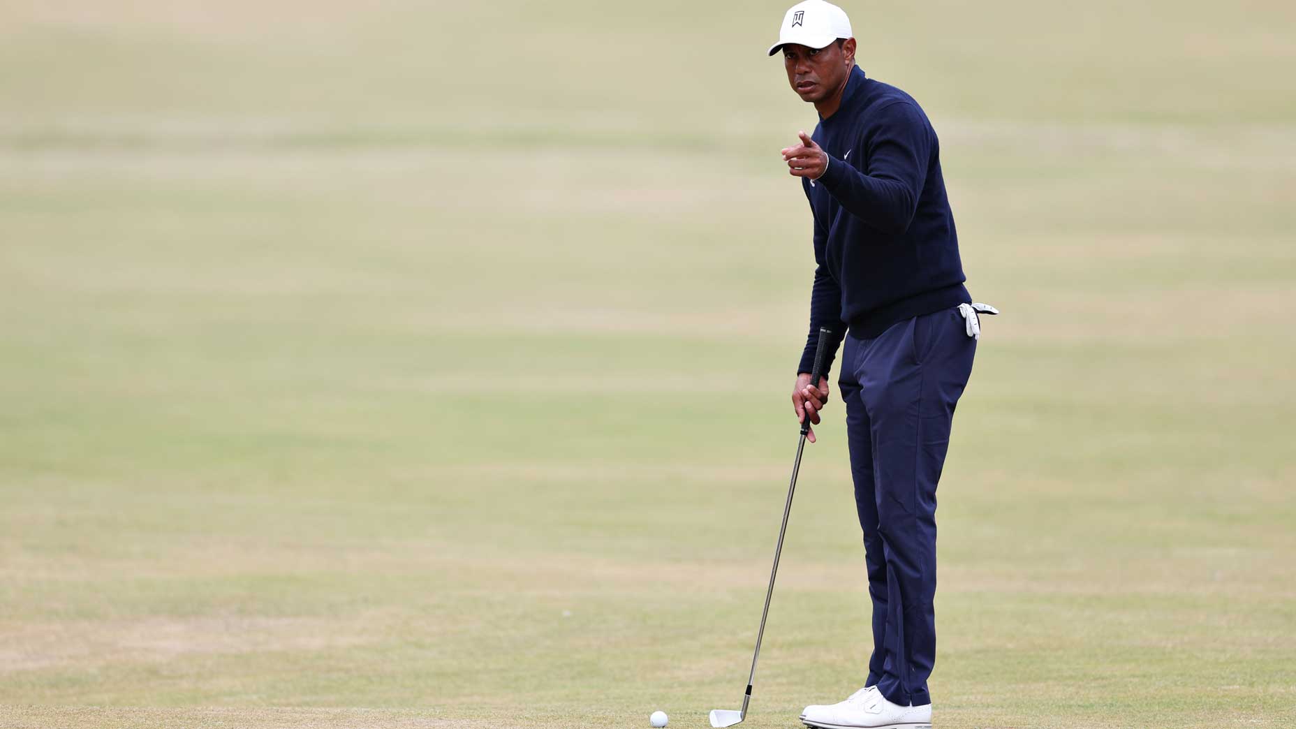 Tiger Woods studying the 18th green on Tuesday.