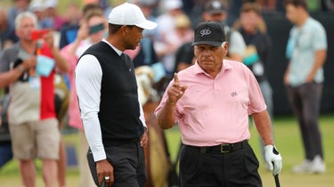 Tiger Woods and Lee Trevino talking shop at St. Andrews.
