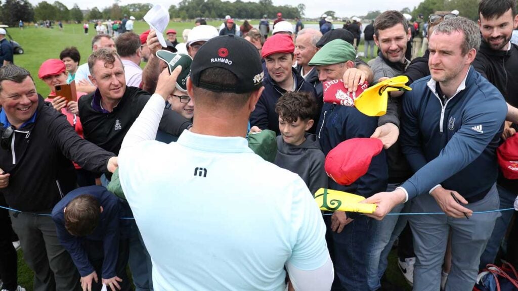 Jon Rahm of Spain signs an autograph for a fan during Day Two of the JP McManus Pro-Am at Adare Manor on July 05, 2022 in Limerick, Ireland.