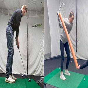 A golfer takes a swing at GOLFTEC.