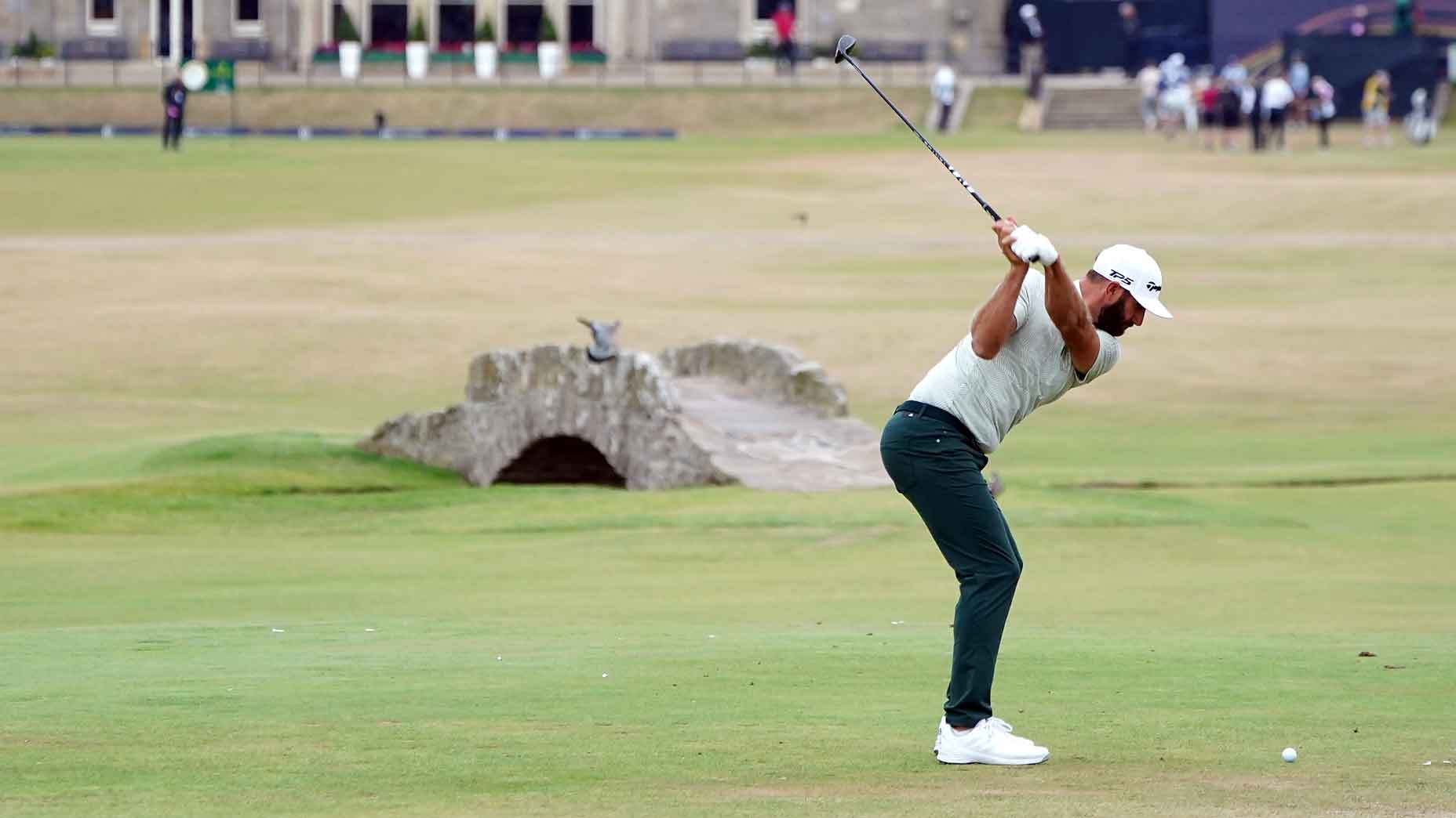 dustin johnson swings on 18 at st.  andrews in 2022 open championship