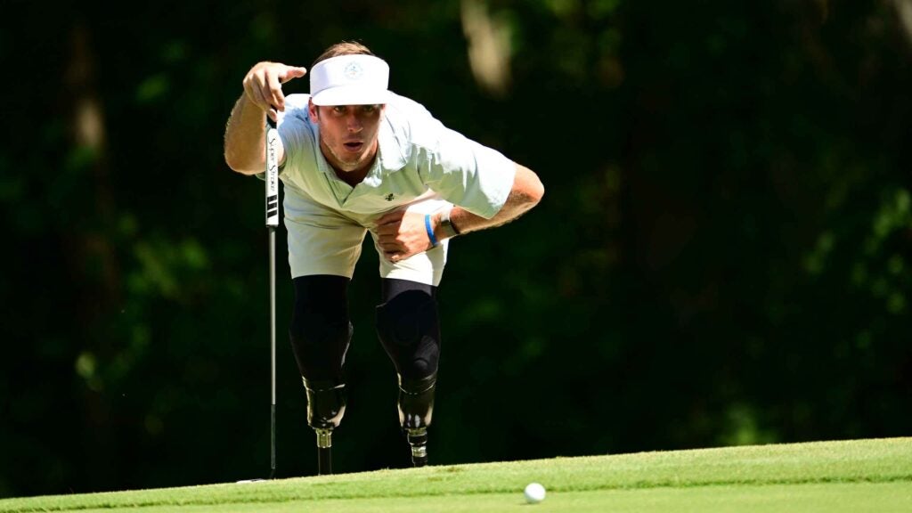 Golfer Jordan Thomas looks at putt during U.S. Adaptive Open
