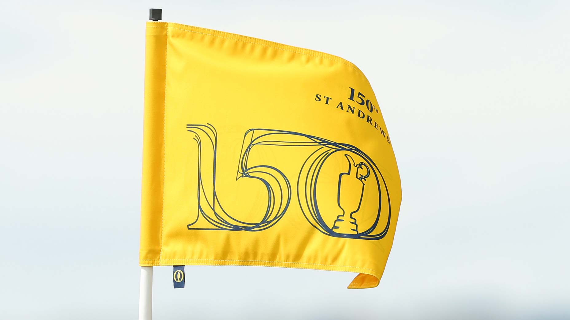 Flagstick blows in wind at 2022 Open Championship.