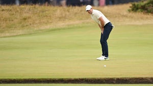 Rory McIlroy watches a putt miss the hole at the british open.