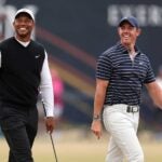 Tiger Woods and Rory McIlroy smile and walk course at St. Andrews