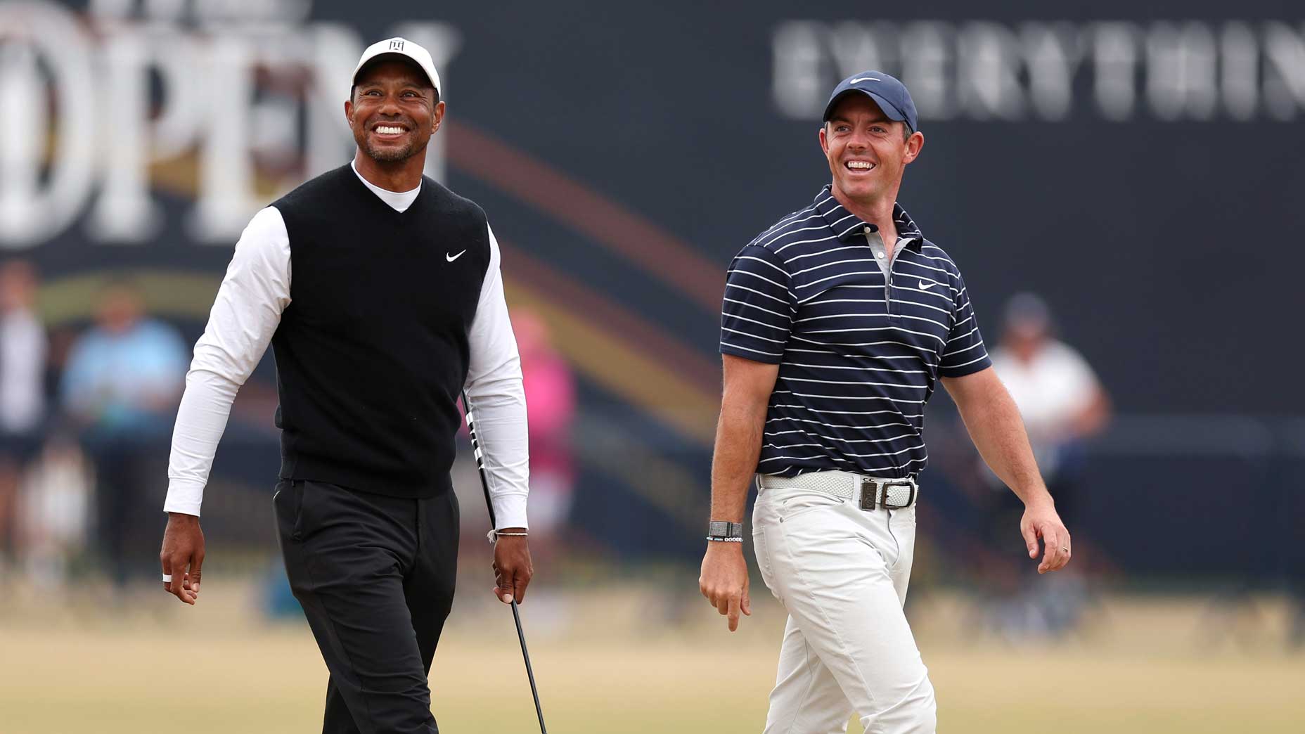 Tiger Woods and Rory McIlroy smile and walk course at St.  Andrews