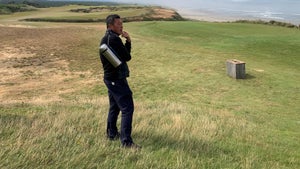 Feng Ding watches his son Wenyi compete in Saturday's final at Bandon Dunes.