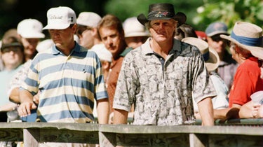 Greg Norman of Australia and Davis Love III of the USA crossing the bridge from the 6th green to the 7th tee during the second round of the US PGA Championships at the Valhalla Golf Club, Louisville, Kentucky, USA.