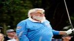 John Daly reacts to a tee shot