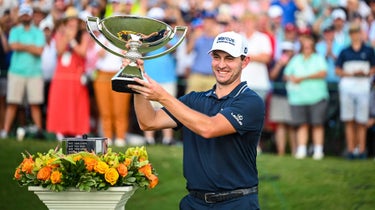 Patrick Cantlay hoists the FedEx Cup Trophy
