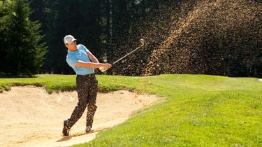 Player hitting from bunker