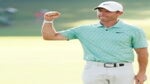 Rory McIlroy of Northern Ireland celebrates on the 18th green after winning during the final round of the TOUR Championship at East Lake Golf Club on August 28, 2022 in Atlanta, Georgia.
