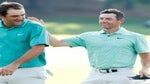 Scottie Scheffler of the United States congratulates Rory McIlroy of Northern Ireland on the 18th green after McIlroy won during the final round of the TOUR Championship at East Lake Golf Club on August 28, 2022 in Atlanta, Georgia.