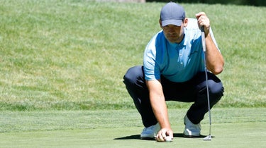 Tony Romo lines up a putt at the American Century Championship.