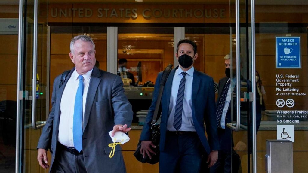 Elliot Peters, left, an attorney representing the PGA Tour, leaves a U.S. courthouse in San Jose, Calif., Tuesday,