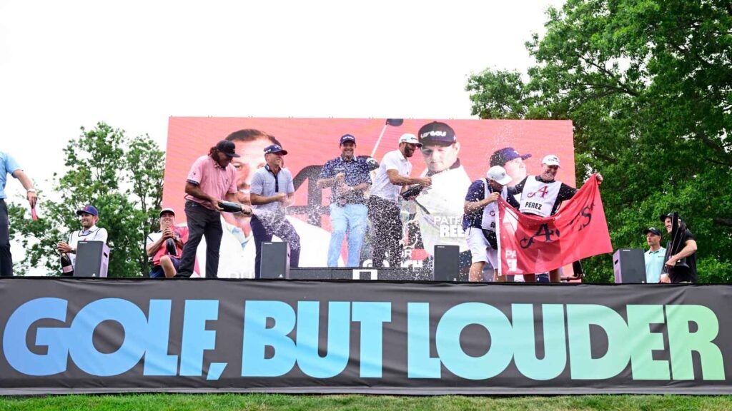 golfers celebrate on podium