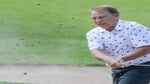 tom Izzo blasts out of a bunker