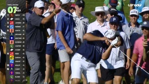 Bryson DeChambeau is hit with a gallery rope.