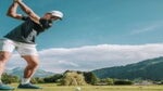 Casper Ruud hits a golf shot in Austria.