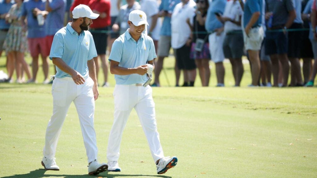 Cameron Young and Collin Morikawa of the United States Team walk the third fairway during the Thursday foursome matches on day one of the 2022 Presidents Cup at Quail Hollow Country Club on September 22, 2022 in Charlotte, North Carolina.