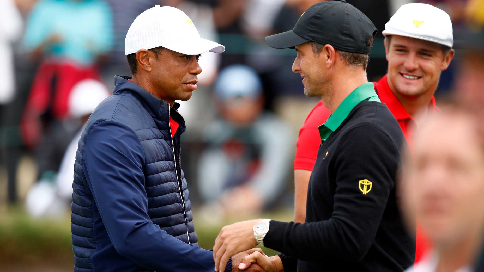 Adam Scott of Australia and the International team shakes hands with Playing Captain Tiger Woods and the United States team after the United States team defeated them 16-14 on day four of the 2019 Presidents Cup at Royal Melbourne Golf Course on December 15, 2019 in Melbourne, Australia.