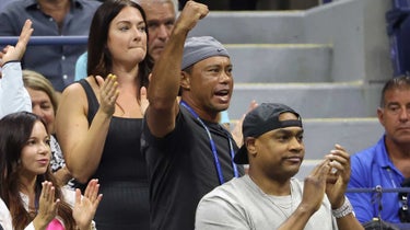 Tiger Woods and girlfriend Erica Herman (bottom left) sat in on Serena Williams' US Open match on Wednesday.