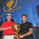 Davis Love III and Trevor Immelman visit the Presidents Cup art mural in downtown Charlotte during the Captains Visit for 2022 Presidents Cup on September 29, 2021 in Charlotte, North Carolina.