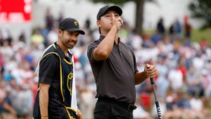 Si woo kim shushes the crowd at the presidents cup