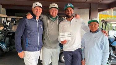Tony Finau poses for a photo after the round of 60