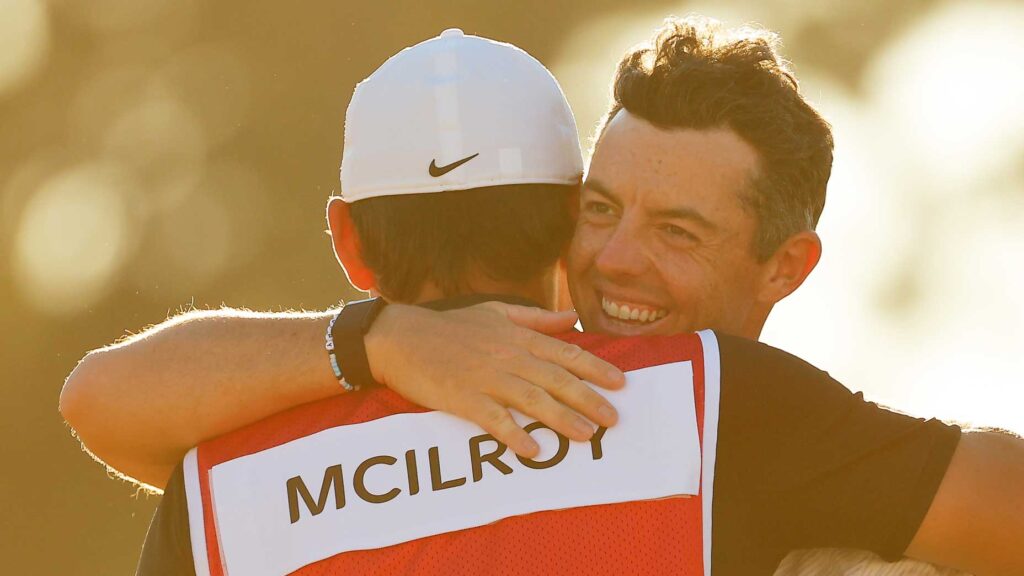 rory mcilroy hugs his caddie after win