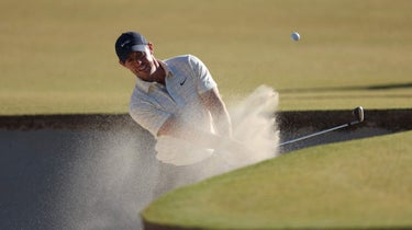 Rory McIlroy of Northern Ireland plays a shot from a bunker on the 13th hole during the third round of the CJ Cup at Congaree Golf Club on October 22, 2022 in Ridgeland, South Carolina.