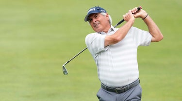 fred couples hitting an iron