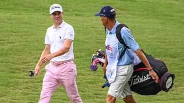 Justin Thomas and Jim "Bones" Mackay walk down the fairway during the final round of the 2020 WGC-FedEx St. Jude Invitational at TPC Southwind in Memphis.