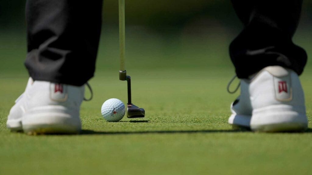 Nick Hardy lines up a putt.