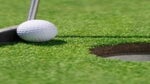golfer lines up short putt
